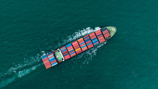 istock logistic cargo container ship sailing in sea to import export goods and distributing products to dealer and consumers across worldwide, by container ship Transport business service. 2169458554