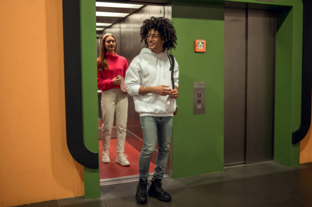 istock Young people using the elevator to get to the library archive 2169459251