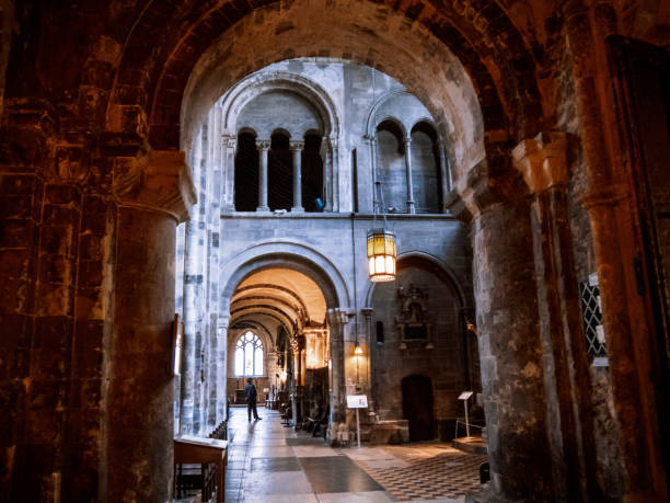 Romanesque arches inside St Bartholomew the Great church in Smithfield, City of London. The church, near the famous St Bartholomew’s Hospital, was founded in 1123 as an Augustinian Priory and both were founded by Rahere following a vision whilst at the Vatican that he should erect a church in Smithfield.