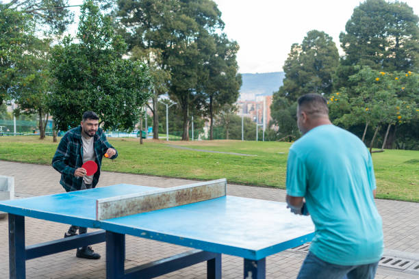 istock friends playing ping pong 2169468442