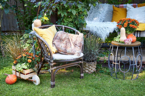 fall garden decor garden swing decorated with fall textiles flowers and pumpkins