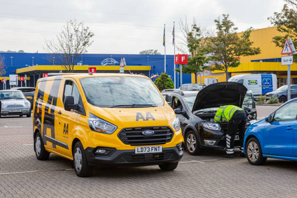 Gateshead UK 08/30/2024\n\nThe AA transit van parked next to a car the car mechanic is giving roadside assistance and repairing a  car