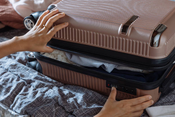 istock Girl packing suitcase 2169476598
