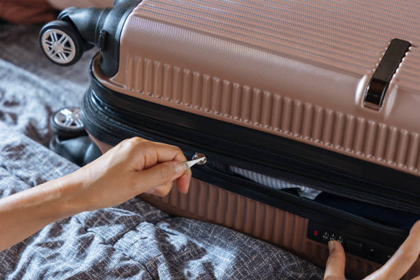 istock Girl packing suitcase 2169476599