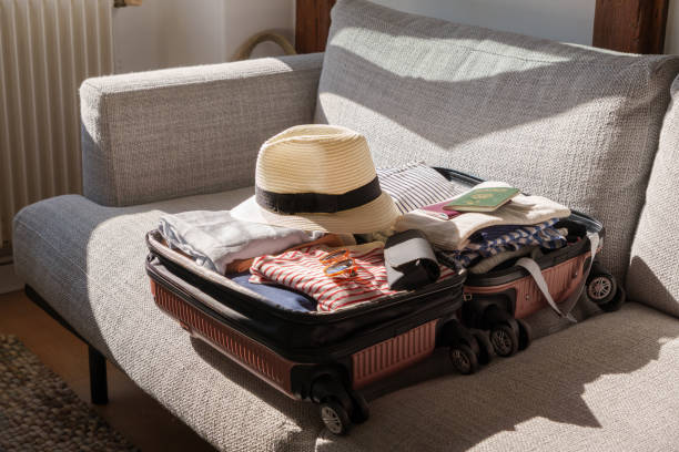 istock Girl packing suitcase 2169476604