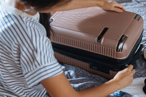 istock Girl packing suitcase 2169476606