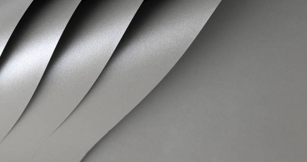istock Gray shiny color paper background, smooth glowing shining silver aluminum texture, fold lines 2169478615