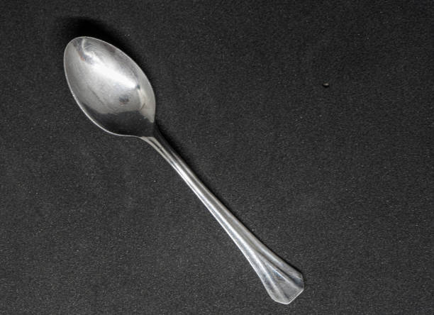 istock Silver Spoon on Dark Background - Elegant and Minimalist Design 2169478880