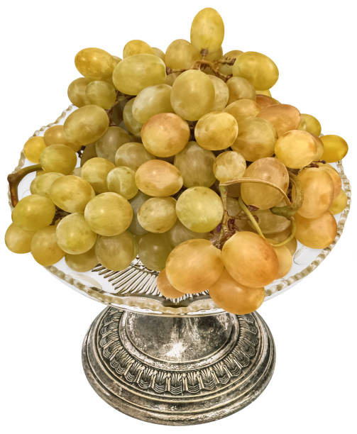 istock Cluster Of White Grape Set On Silver Footed Crystal Fruit Serving Stand Isolated on White Background High Angle View High Resolution Stock Image 2169479880