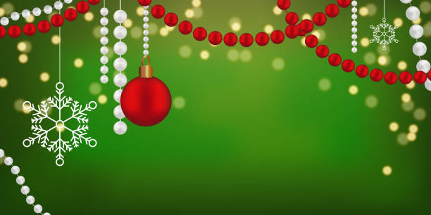 istock Green background golden sparkles falling down Xmas mood Copy space Red ball beads Snowflakes 2169483483