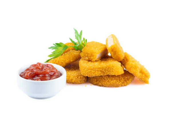istock Delicious chicken nuggets on black background. Cooked or raw chicken nuggets 2169484825