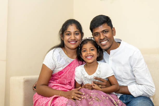 istock A couple and their child relax on a sofa 2169484831