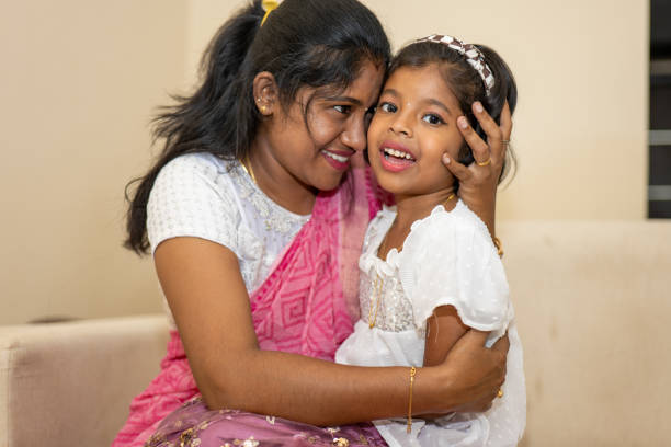 istock A woman and a child are hugging each other 2169484948