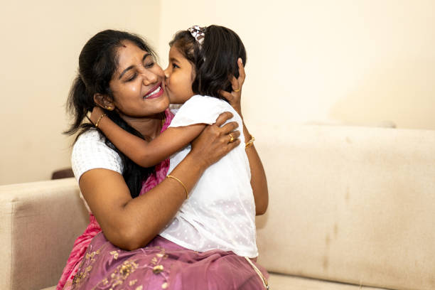 istock A woman is hugging a small child 2169484952