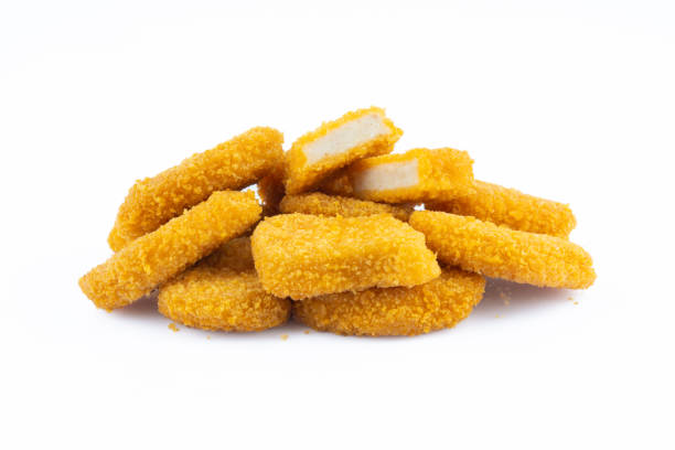 istock Delicious chicken nuggets on black background. Cooked or raw chicken nuggets 2169485292