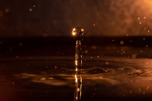 Close up of light blue raindrop splash crown