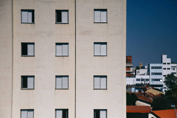 Urban Facade: Apartment Building with White Windows