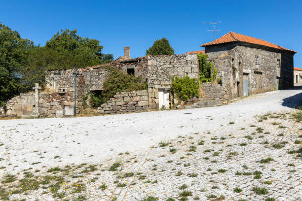 istock Old abandoned granite house with religious christianity cross 2169490441