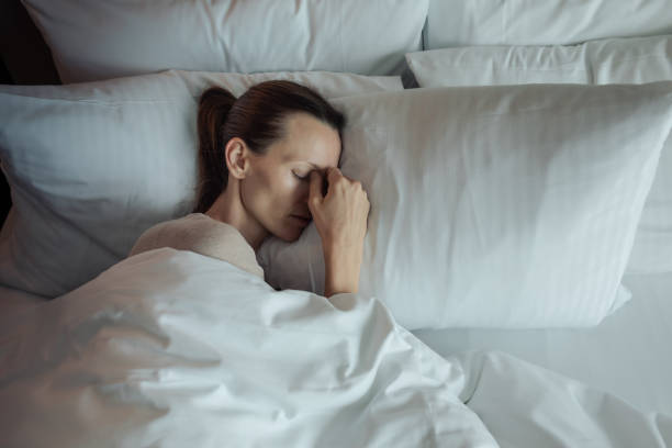 istock Young woman in bed having trouble sleeping, insomnia, stress concept. 2169498397
