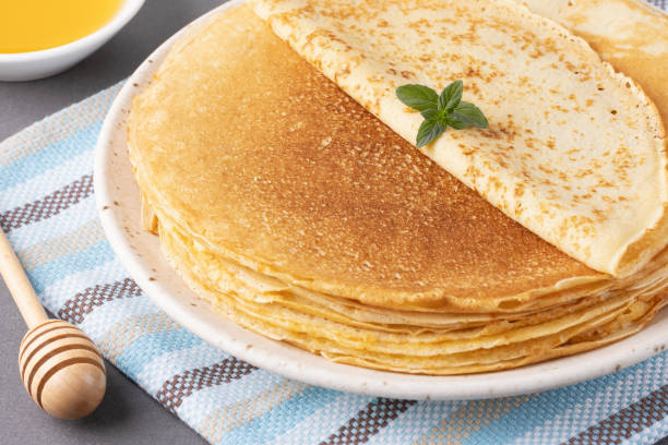 istock Stack of traditional russian pancakes blini on gray background with copy space. Homemade russian thin pancakes blini. Russian food, russian kitchen 2169498685