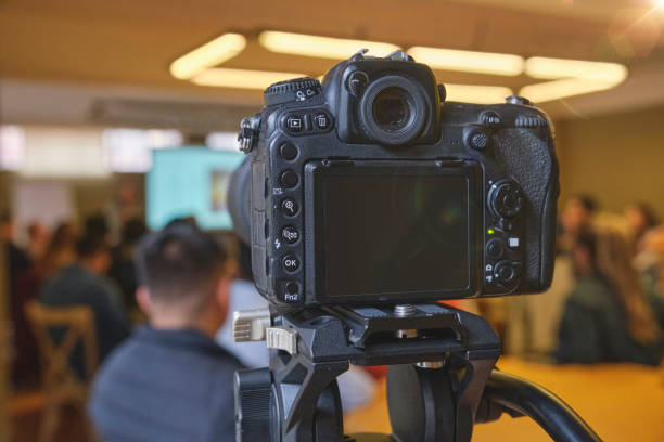 istock A camera is pointed at a group of people 2169499704