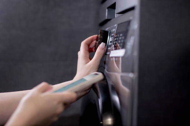 istock Smartphone with app used to control washing machines 2169504836
