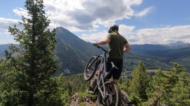 istock Mountain biker looks towards distant mountain 2169510886