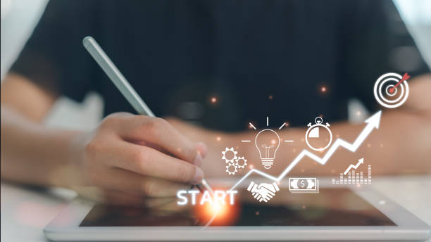 istock Startup concept with icon business and network connection on the modern virtual interface from the digital tablet. man writing on a tablet. 2169511078