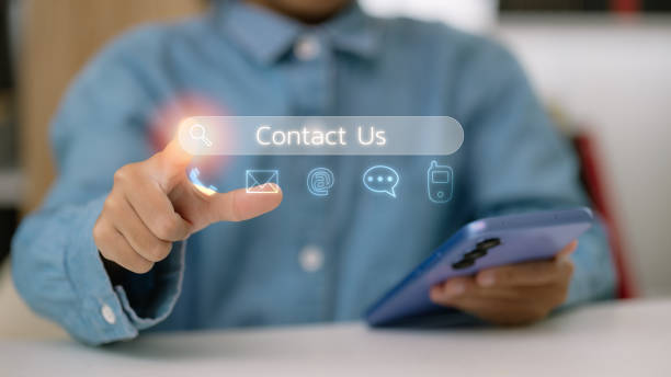 istock Contact us or Customer support hotline people connect. Businessman using a laptop and touching on virtual screen contact icons ( email, address, live chat, internet wifi ) 2169511163