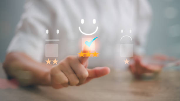 istock Customer service and Satisfaction concept, Business people touching the virtual screen on the happy Smile face icon to give satisfaction in service. rating very impressed. 2169511216