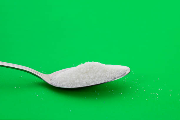 Spoon with a little refined white sugar