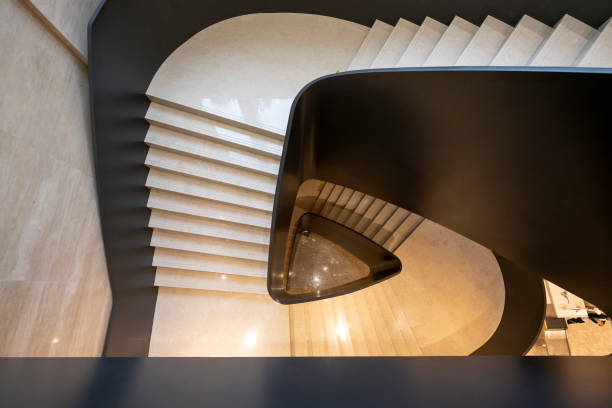 istock Downward spiral staircase 2169513947