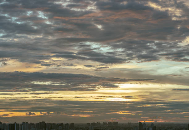 Colorful sunset and cloud sky background over Metropolitan. The skyscape is being covered with Amazing evening clouds like a heaven, Nature abstract composition for background wallpaper, textures and space for text, Selective focus.
