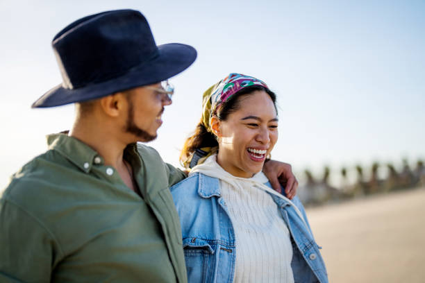 istock Cheerful Hispanic Couple on a Sunny Beach Excursion 2169523774