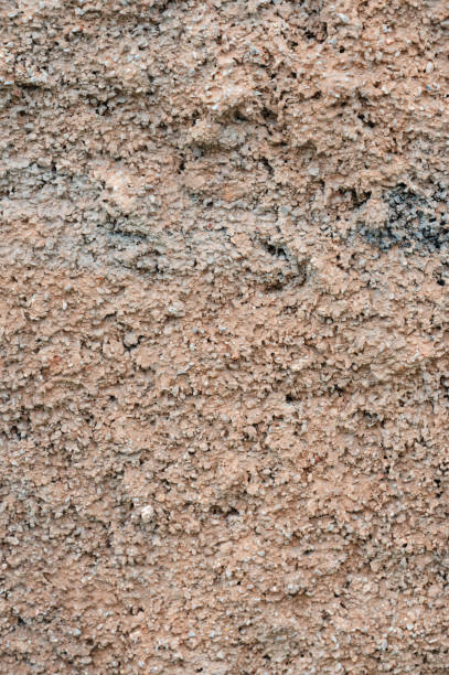 istock Textured plaster wall with earthy tones 2169529452