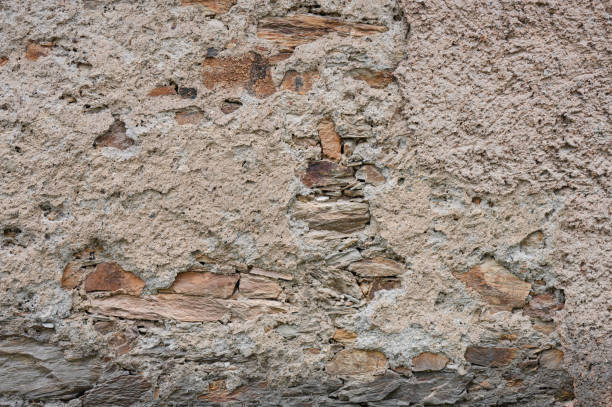 istock Textured plaster wall with earthy tones 2169529460
