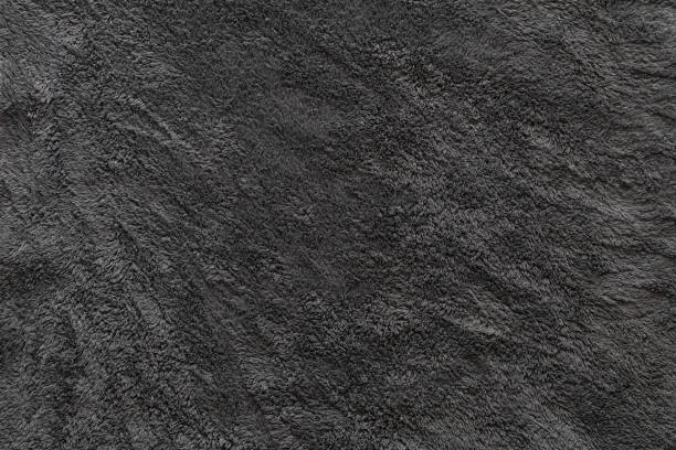 istock Clothing fabric black microfiber texture background, close up of cloth textile surface abstract. 2169530627