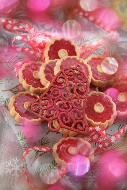 Christmas atmospheric mood. Thumbprint breakfast cookies with raspberry jam. Homemade freshly baked shortbread cookies, Happy New Year