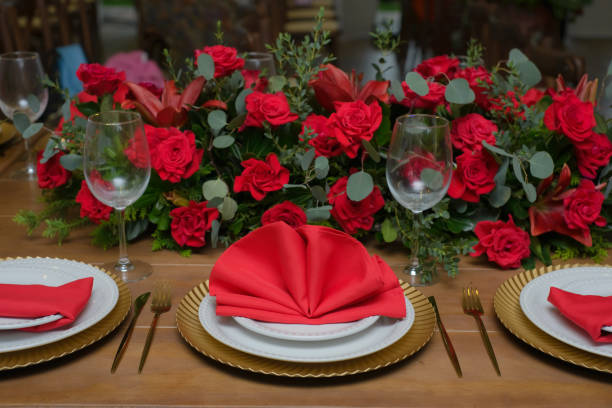 istock Table decorated with napkin and red roses for a celebration. 2169532210