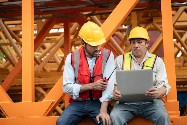 istock Asia engineer man worker use tablet computer and India engineer man use walkie talkie working with crane spare part background 2169534027