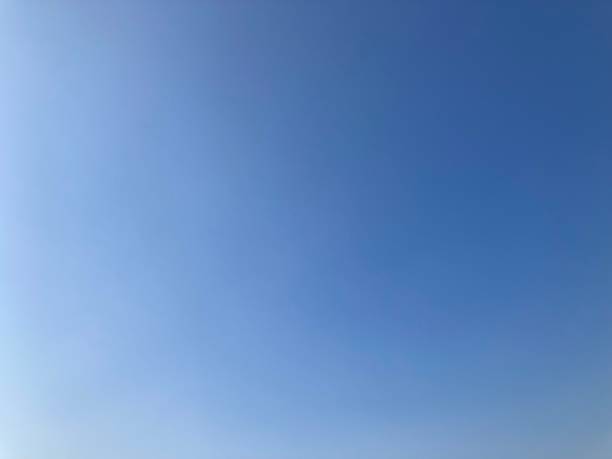 istock empty cloudless sky ranging in color from white to bright blue 2169534099
