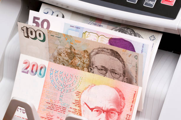 istock Israeli new shekel in the counting machine 2169534783