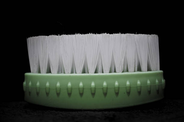 Close up of hand brush isolated on black background