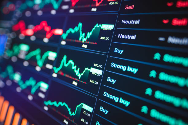istock Dynamic financial dashboard displaying real-time investment data and AI insights on multiple screens 2026 2169538154