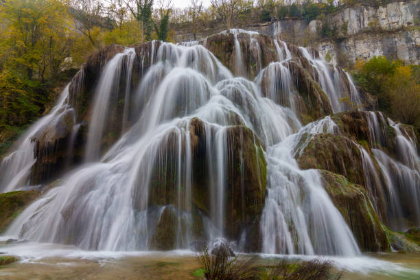 istock Baume-les-Messieurs waterfall in autumn 2169539826