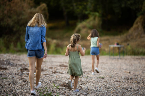 istock Happy family by the river 2169539957