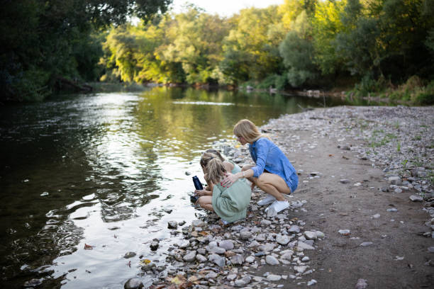 istock Happy family by the river 2169540186