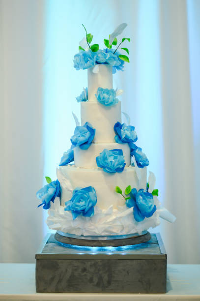 istock Beautiful blue wedding cake decorated with flowers 2169541656