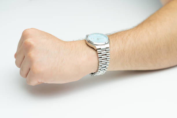 istock Hand with modern wrist watch on white background 2169542234