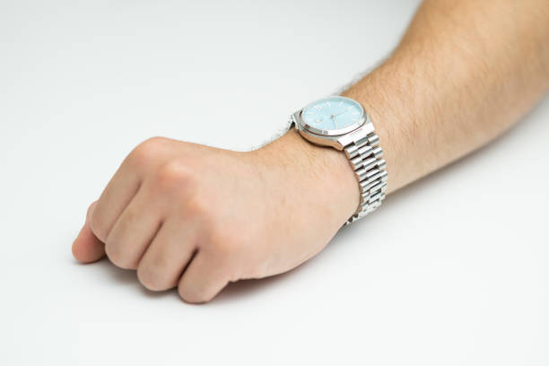 istock Hand with modern wrist watch on white background 2169542243